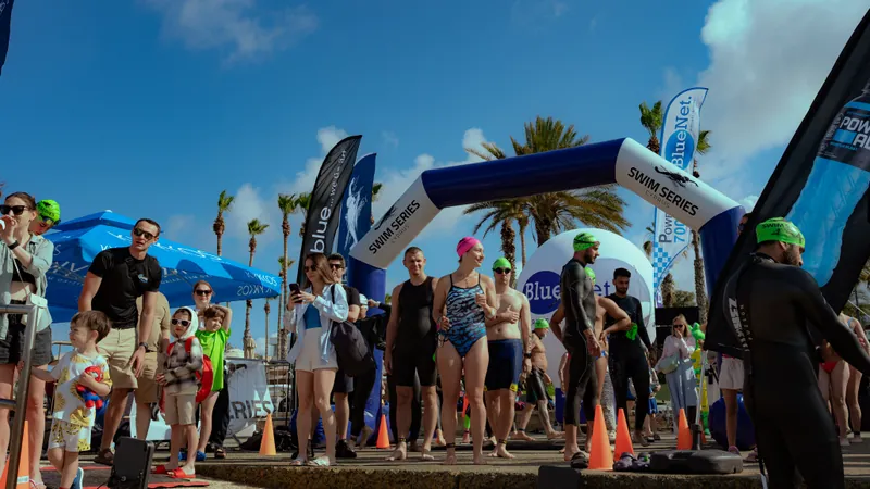 Swimmers on the start line at a Cyprus Swim Series race